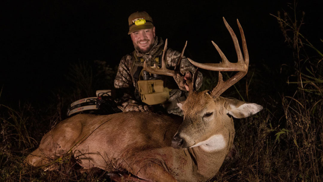 Mike Hunsucker holding up a Missouri whitetail buck